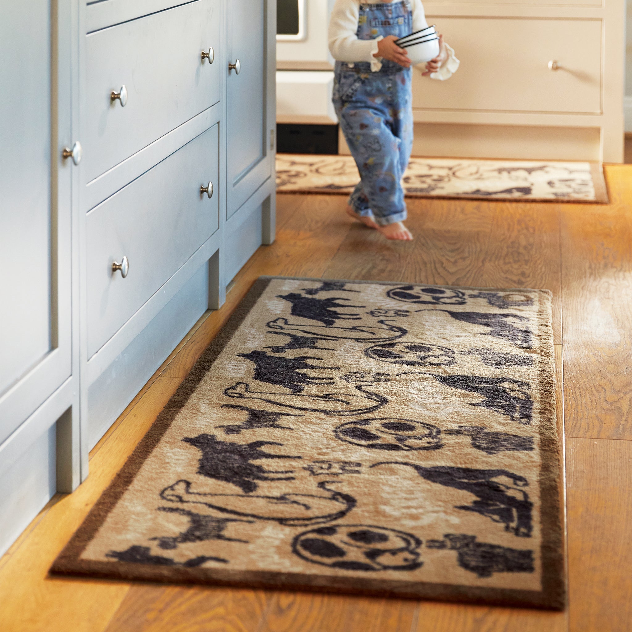 Lifestyle image of a beige battersea dogs washable kitchen runner