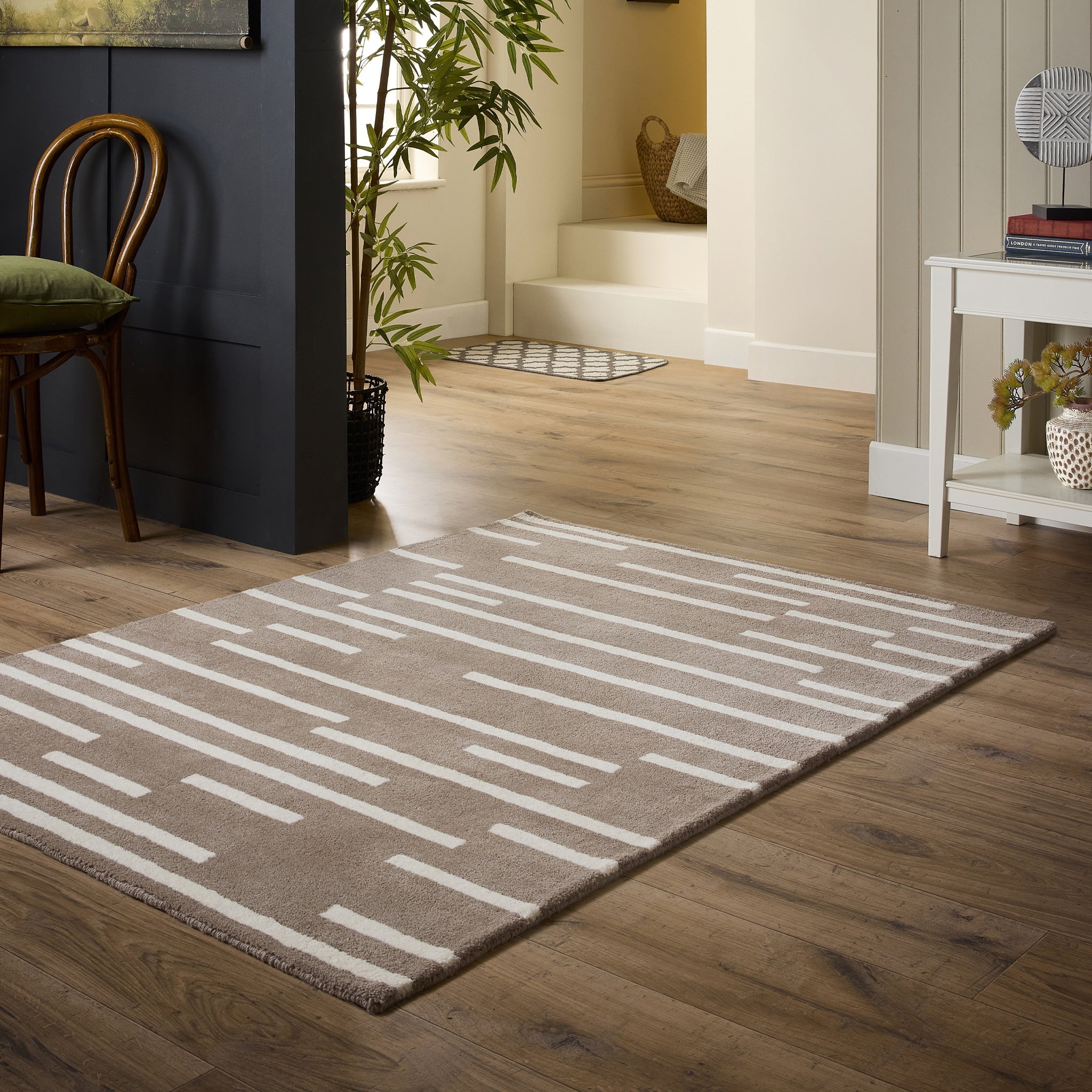 Broken Stripe- hand-tufted wool cut pile rug in Brown and White with a broken striped design.