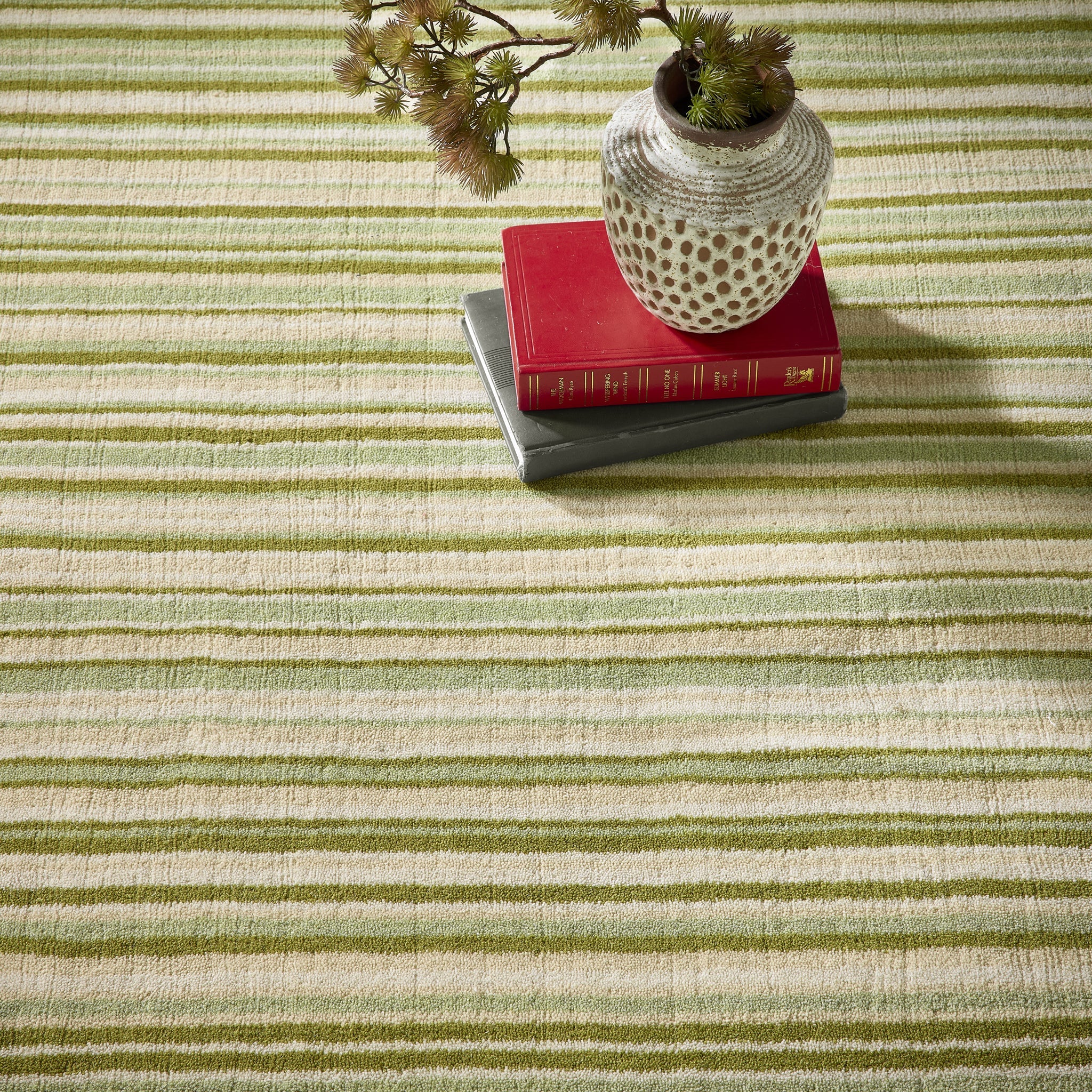 Green Fine Stripe Rug- 100% wool cut pile in green with a striped pattern.
