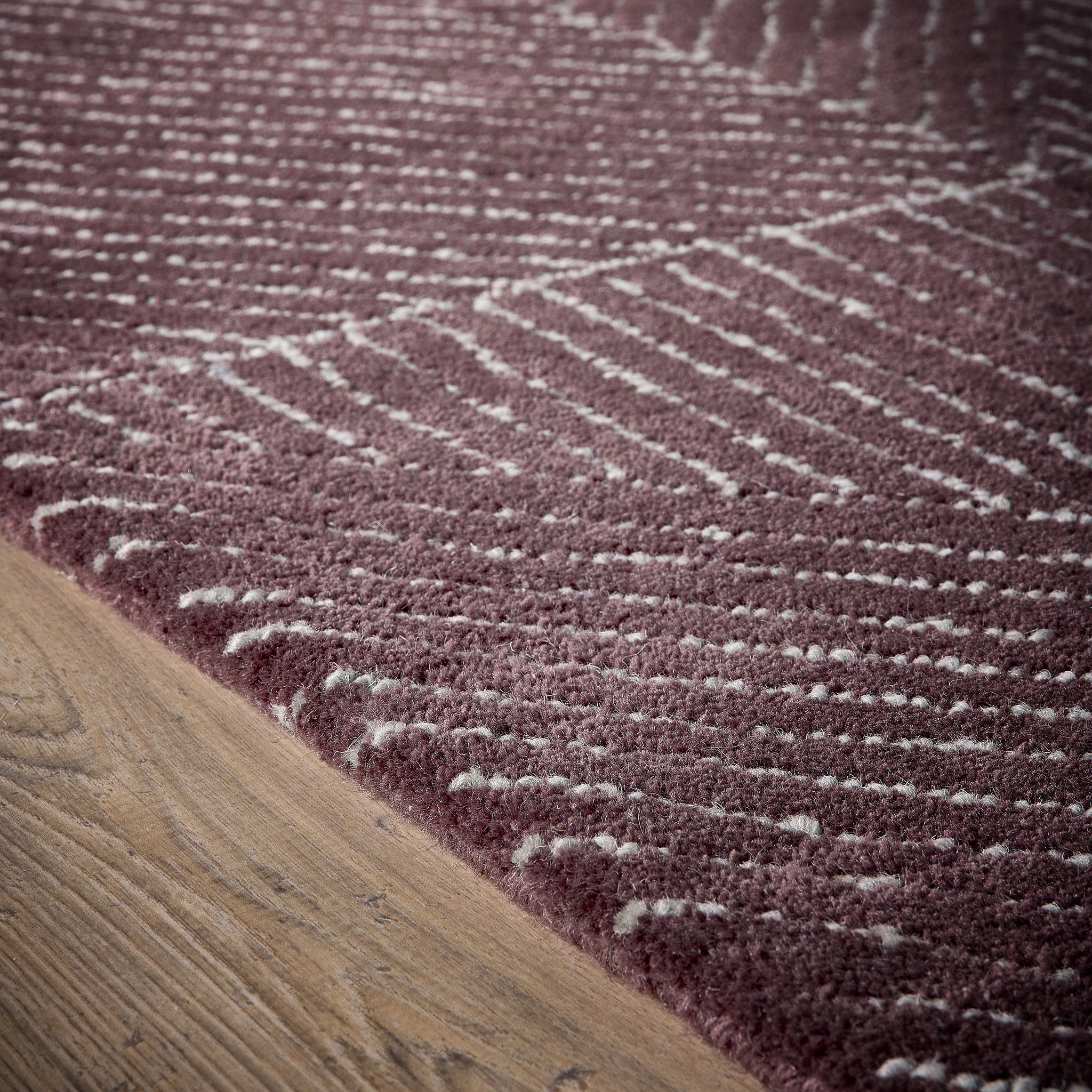 Geometric Rug- 100% Wool cut pile rug in Berry with a 3D pattern.