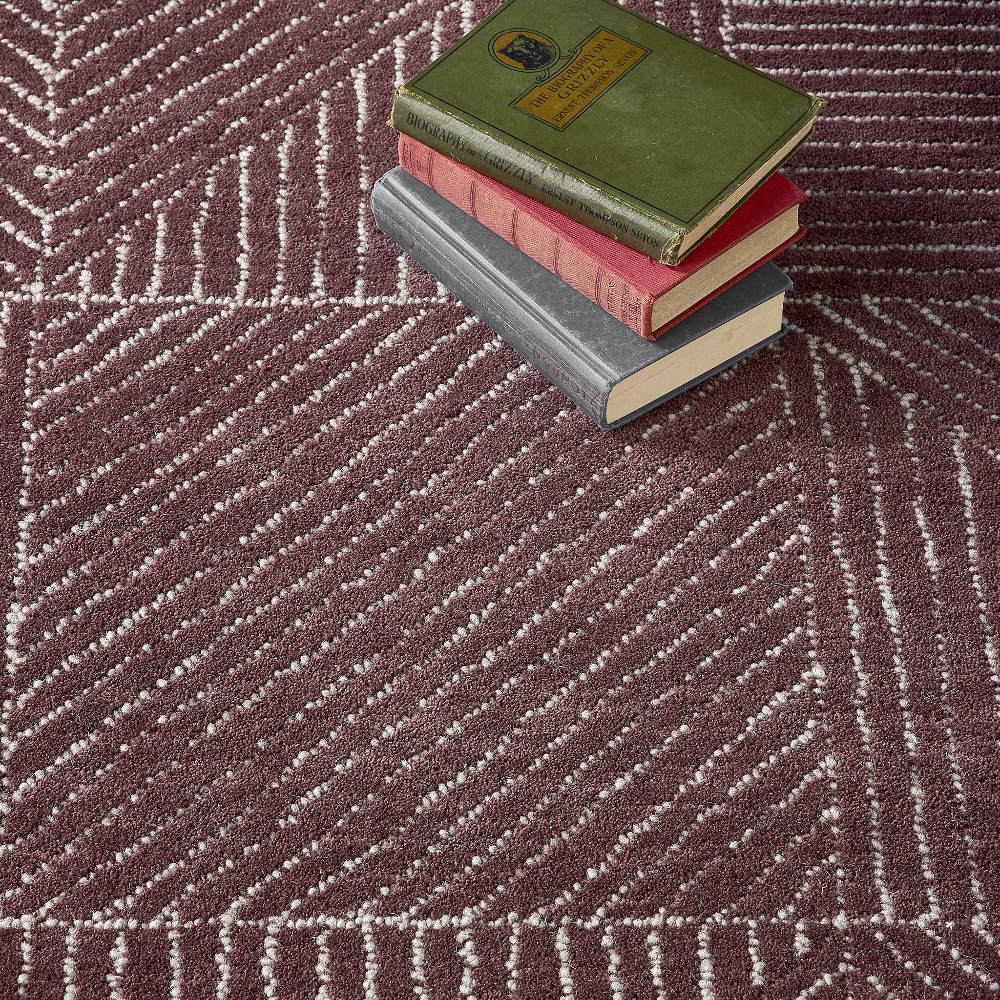 Geometric Rug- 100% Wool cut pile rug in Berry with a 3D pattern.