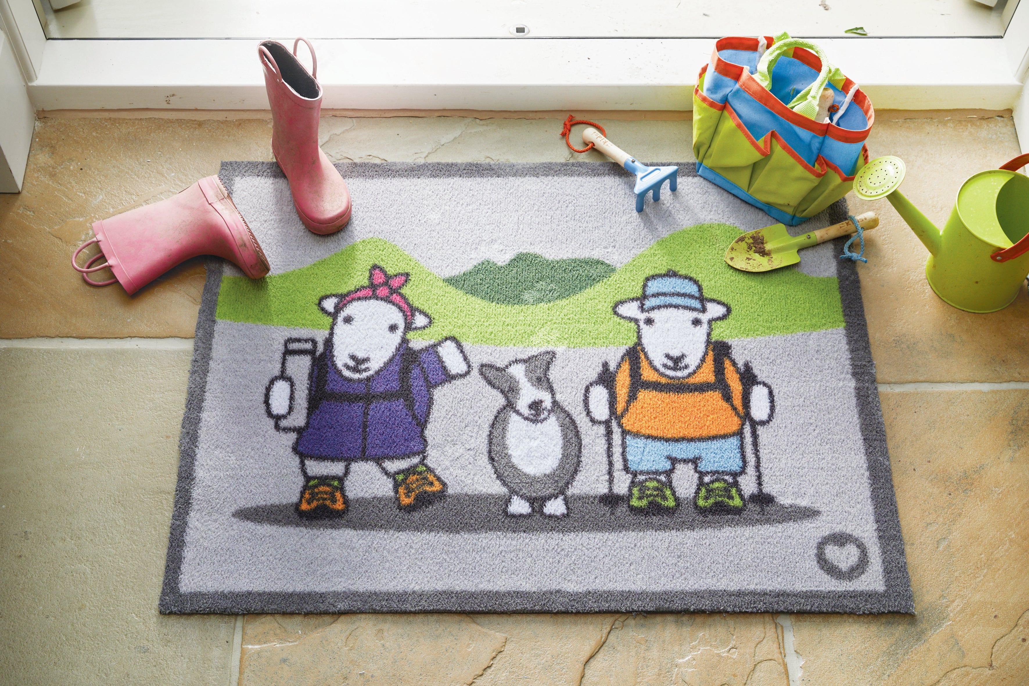 Herdy Hiker rug with boots and outdoor tools on top