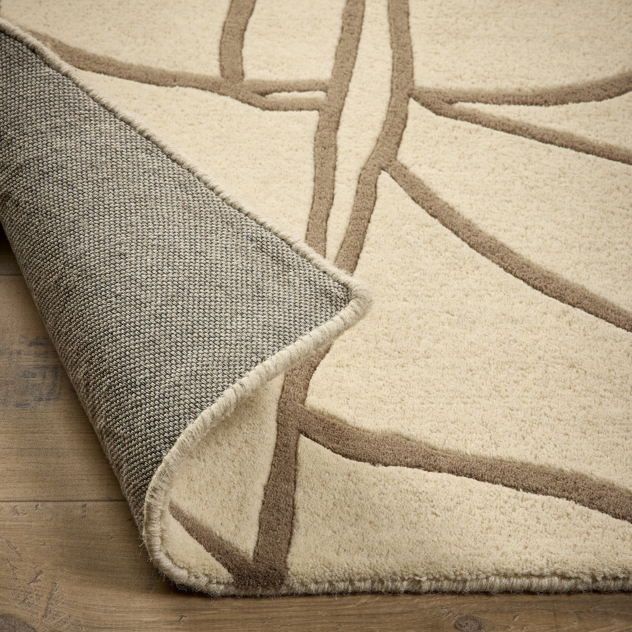 Kintsugi- 100% Wool Cut Pile rug in Cream with a carved pattern.