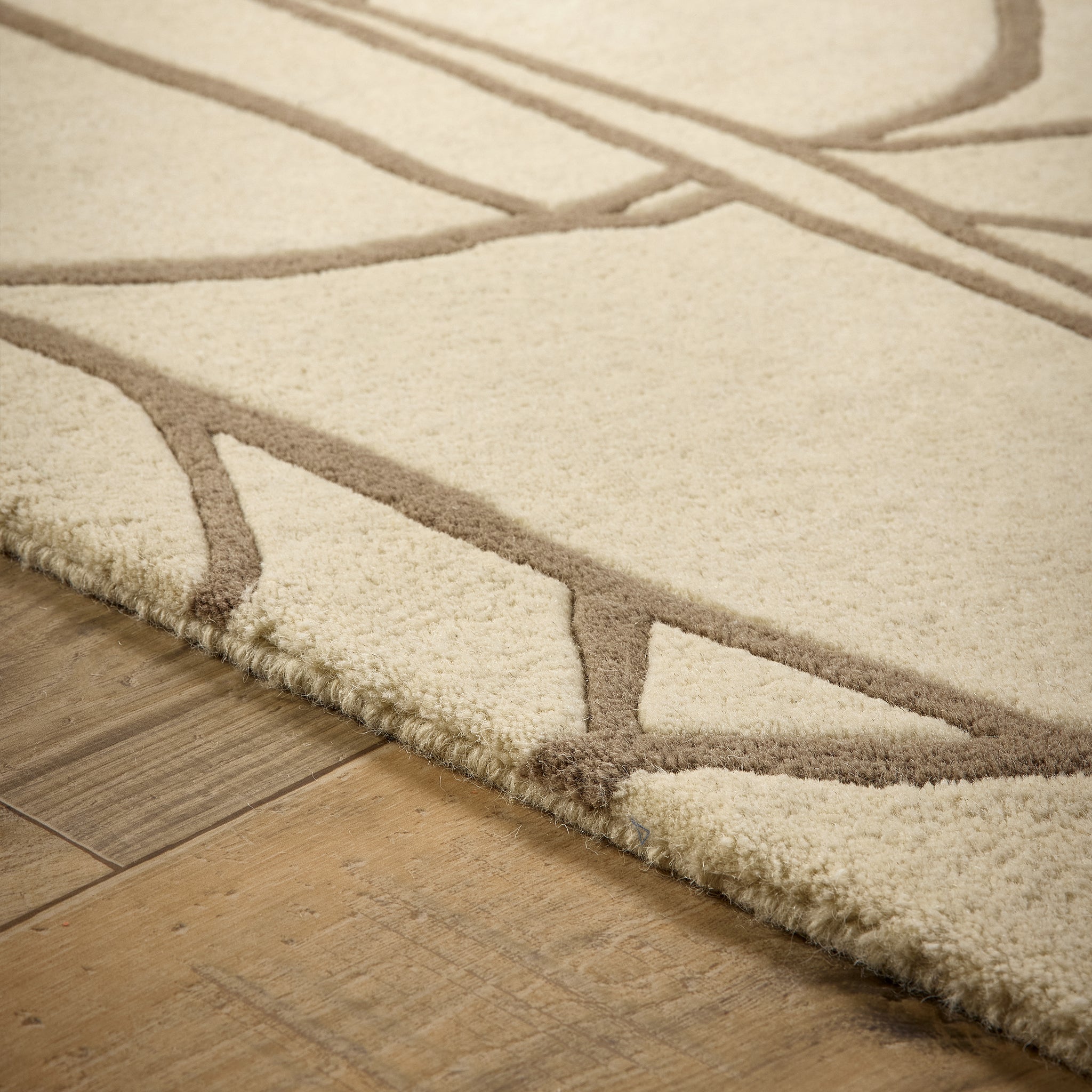 Kintsugi- 100% Wool Cut Pile rug in Cream with a carved pattern.