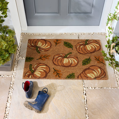 Discover the Multi Pumpkins Coir Doormat- a coir doormat with pumpkins and green\orange leaves.