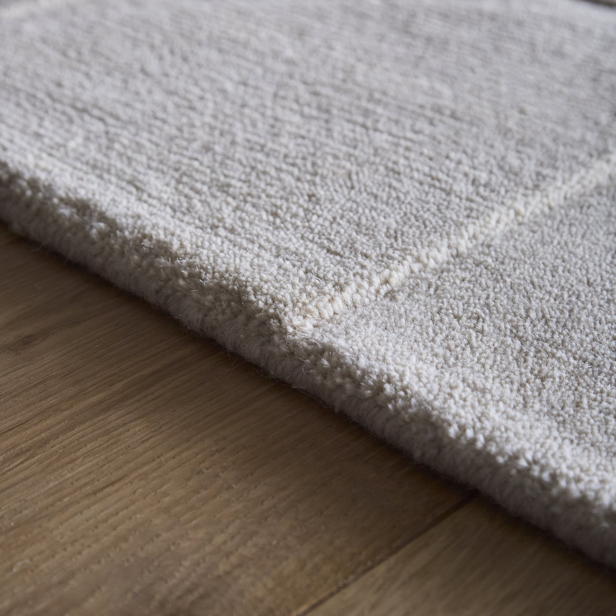 Penny Rug – 100% wool hand-tufted rug in Infinity blue with sculpted 3D geometric pattern.