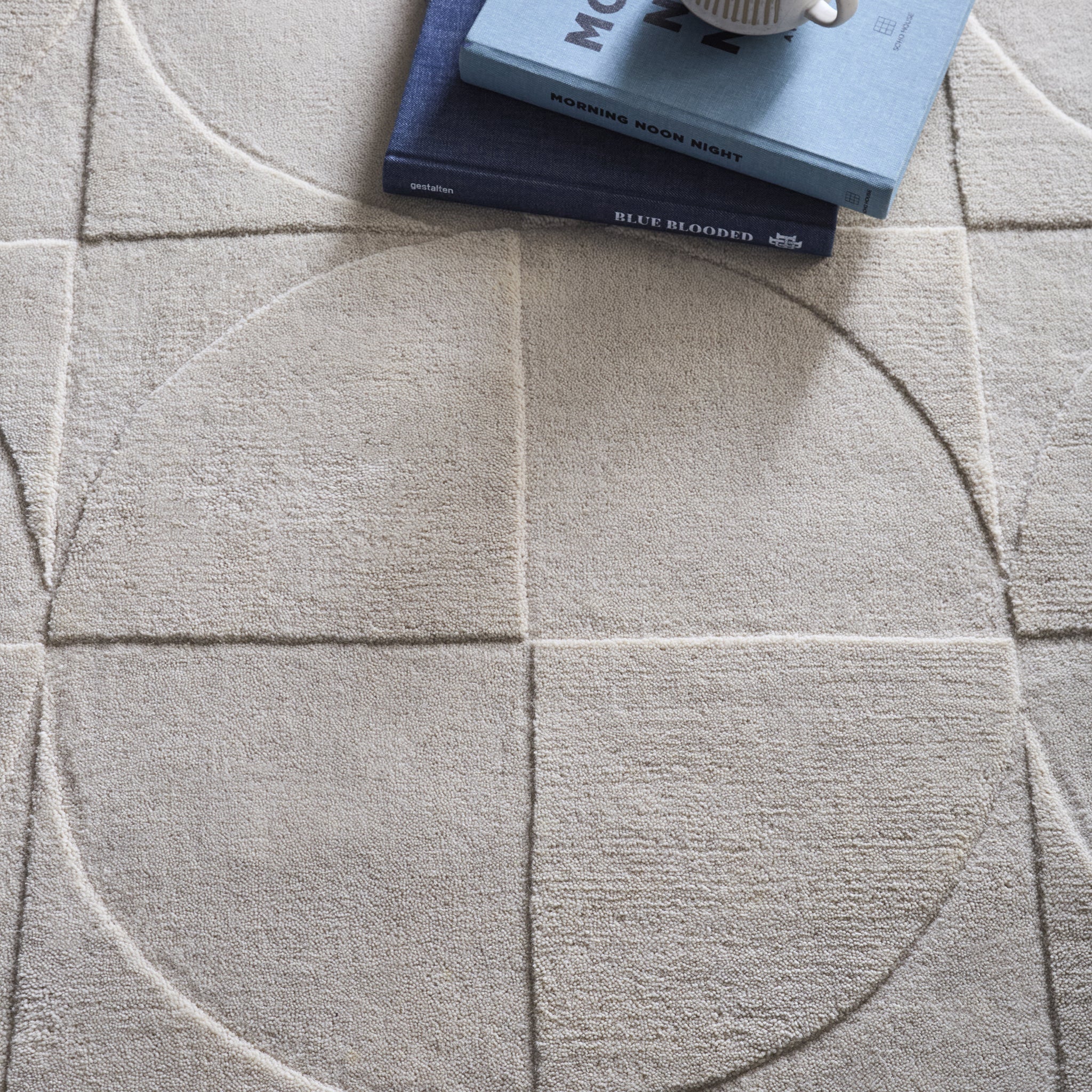 Penny Rug – 100% wool hand-tufted rug in Infinity blue with sculpted 3D geometric pattern.