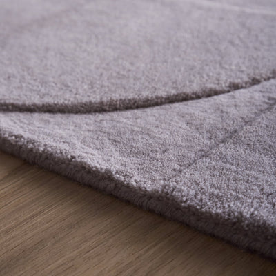 Penny Rug – 100% wool hand-tufted rug in Infinity blue with sculpted 3D geometric pattern.