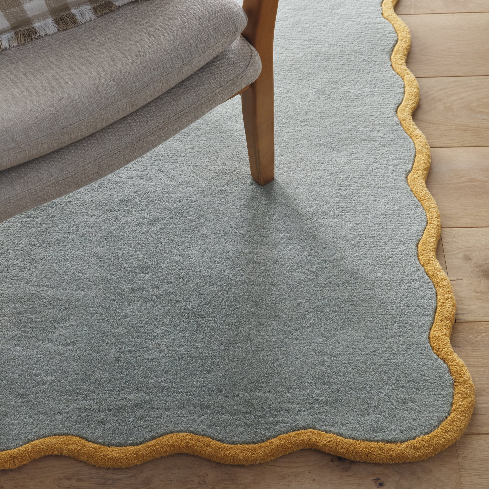 Scalloped Elsie Rug- a 100% hand-tufted rug in Duck Egg with wavy border.