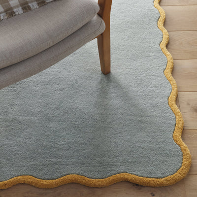 Scalloped Elsie Rug- a 100% hand-tufted rug in Duck Egg with wavy border.
