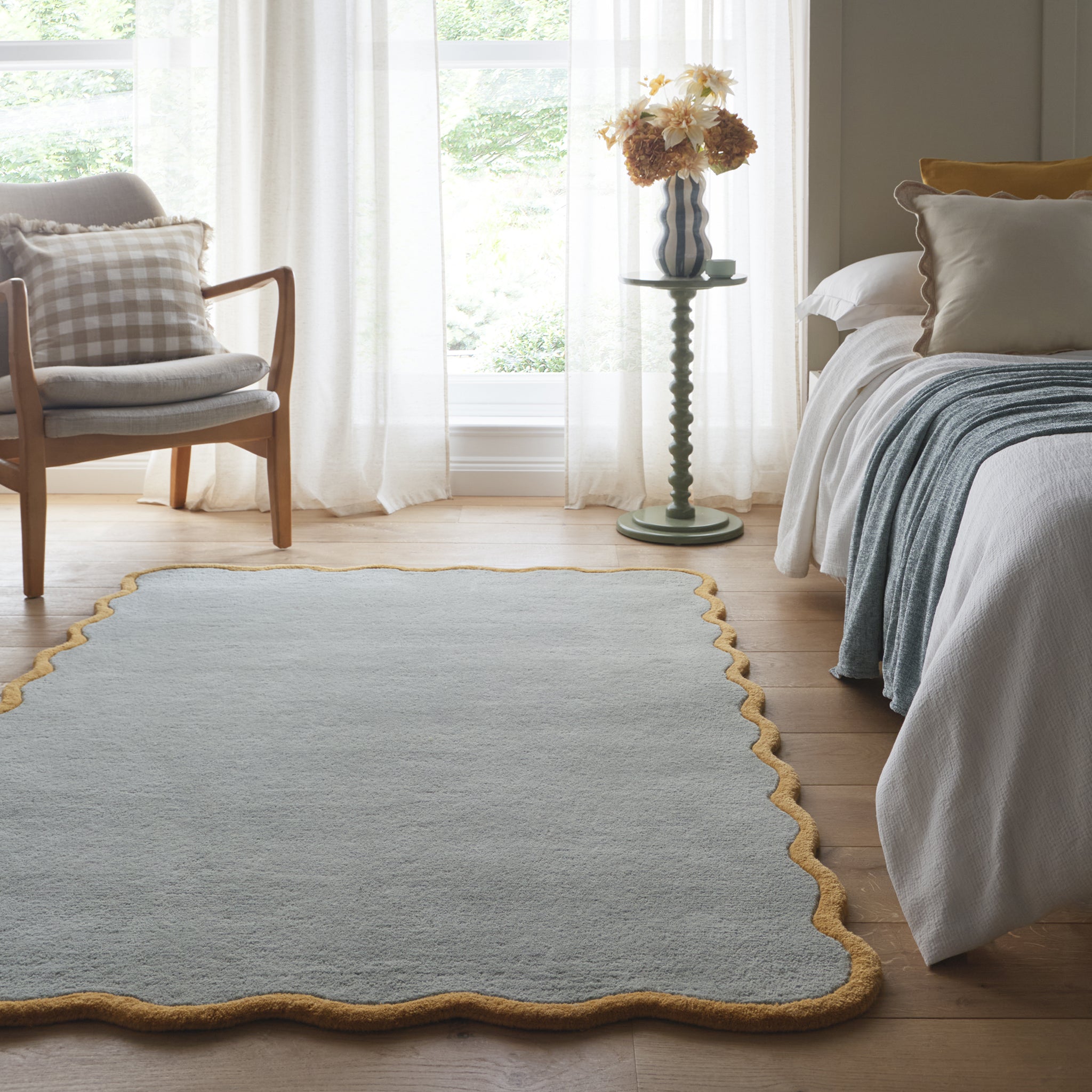 Scalloped Elsie Rug- a 100% hand-tufted rug in Duck Egg with wavy border.