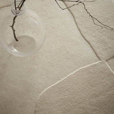 Sculptured Wool Boulder Rug- a 100% wool cut pile rug in Cream with a patterned design.