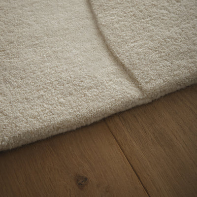 Sculptured Wool Boulder Rug- a 100% wool cut pile rug in Cream with a patterned design.