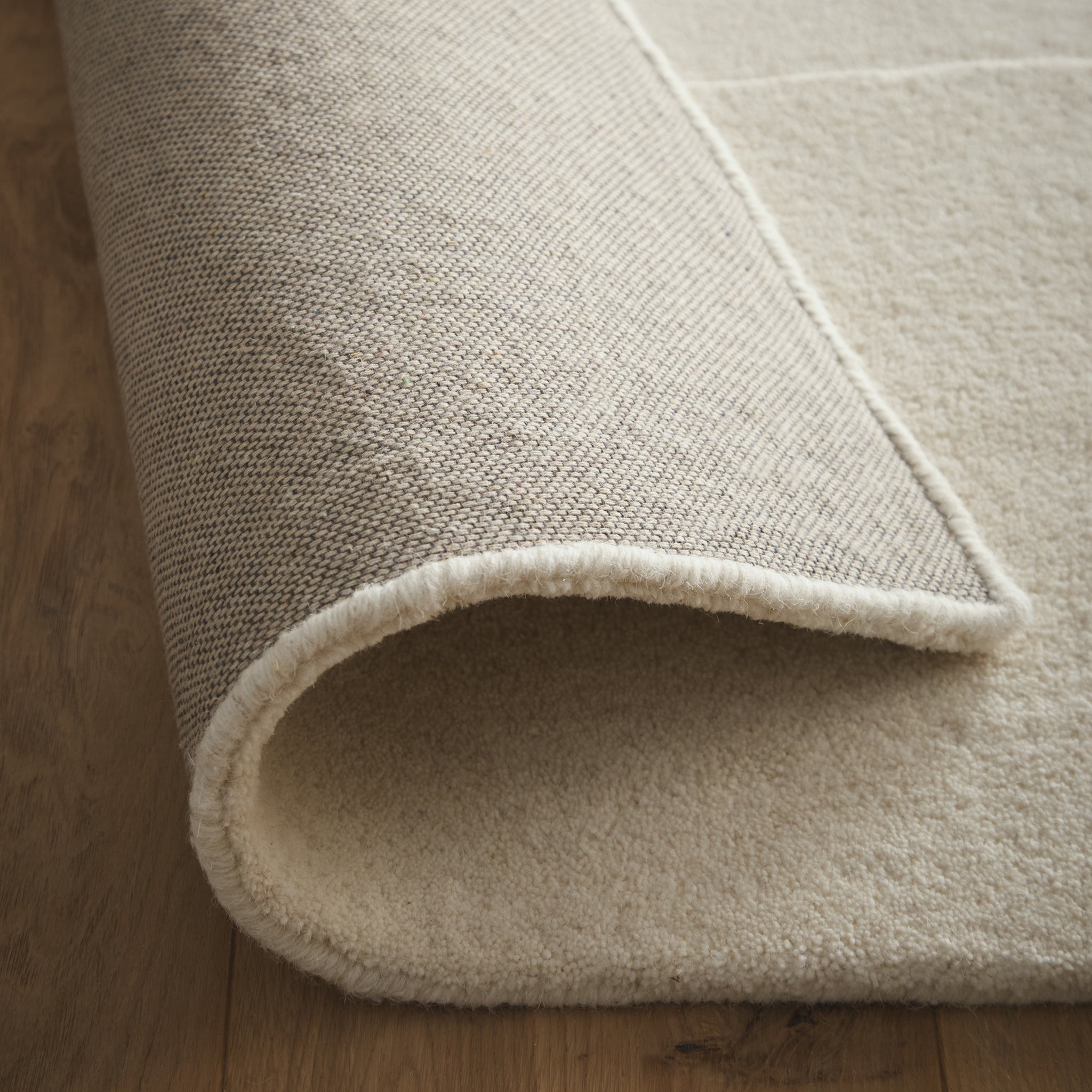 Sculptured Wool Boulder Rug- a 100% wool cut pile rug in Cream with a patterned design.