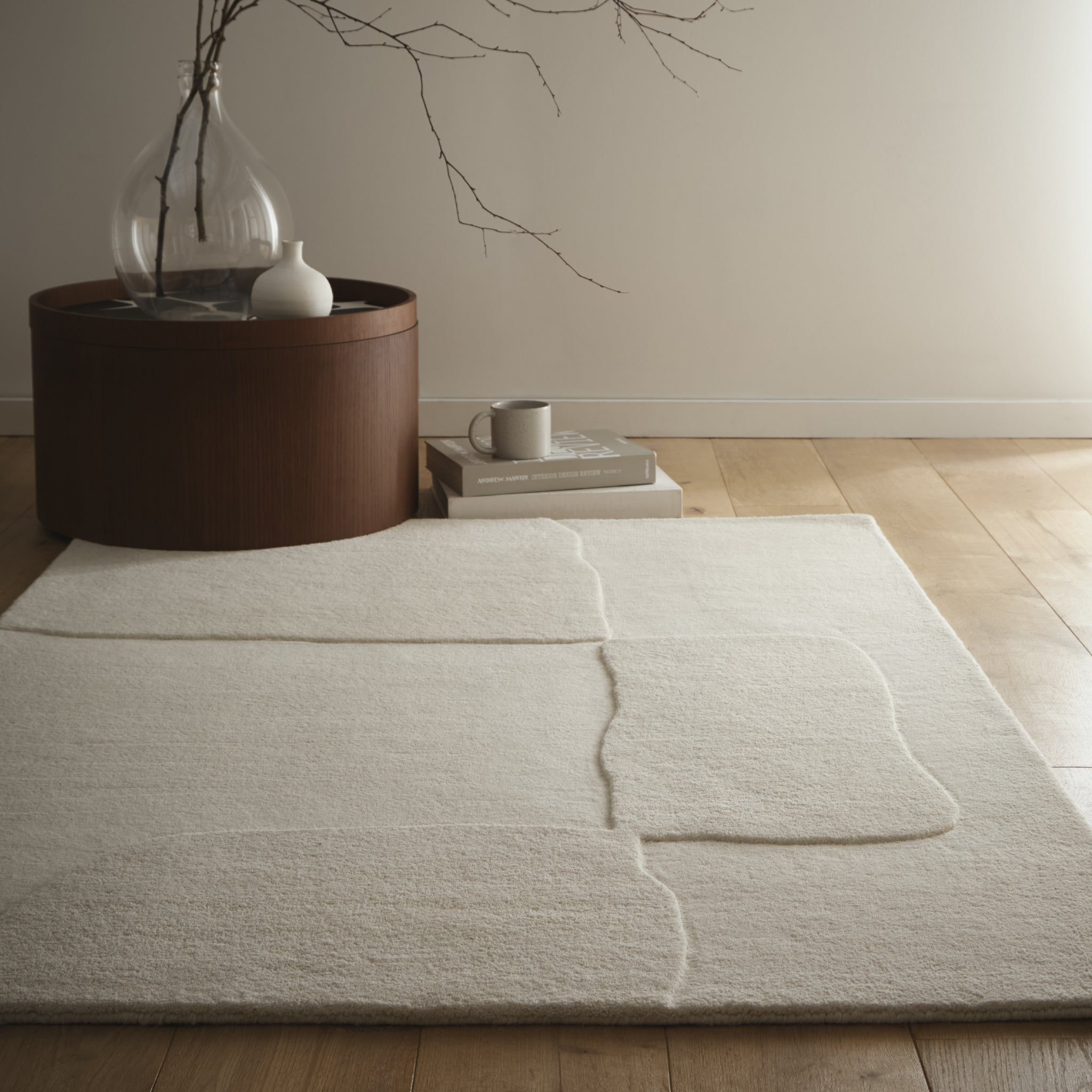 Sculptured Wool Boulder Rug- a 100% wool cut pile rug in Cream with a patterned design.