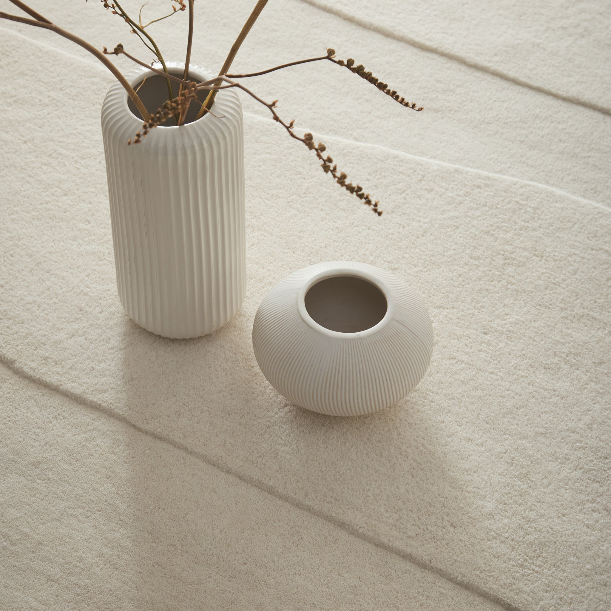 Sculptured Rug- 100% wool cut pile rug in Cream with a sculptured pattern.