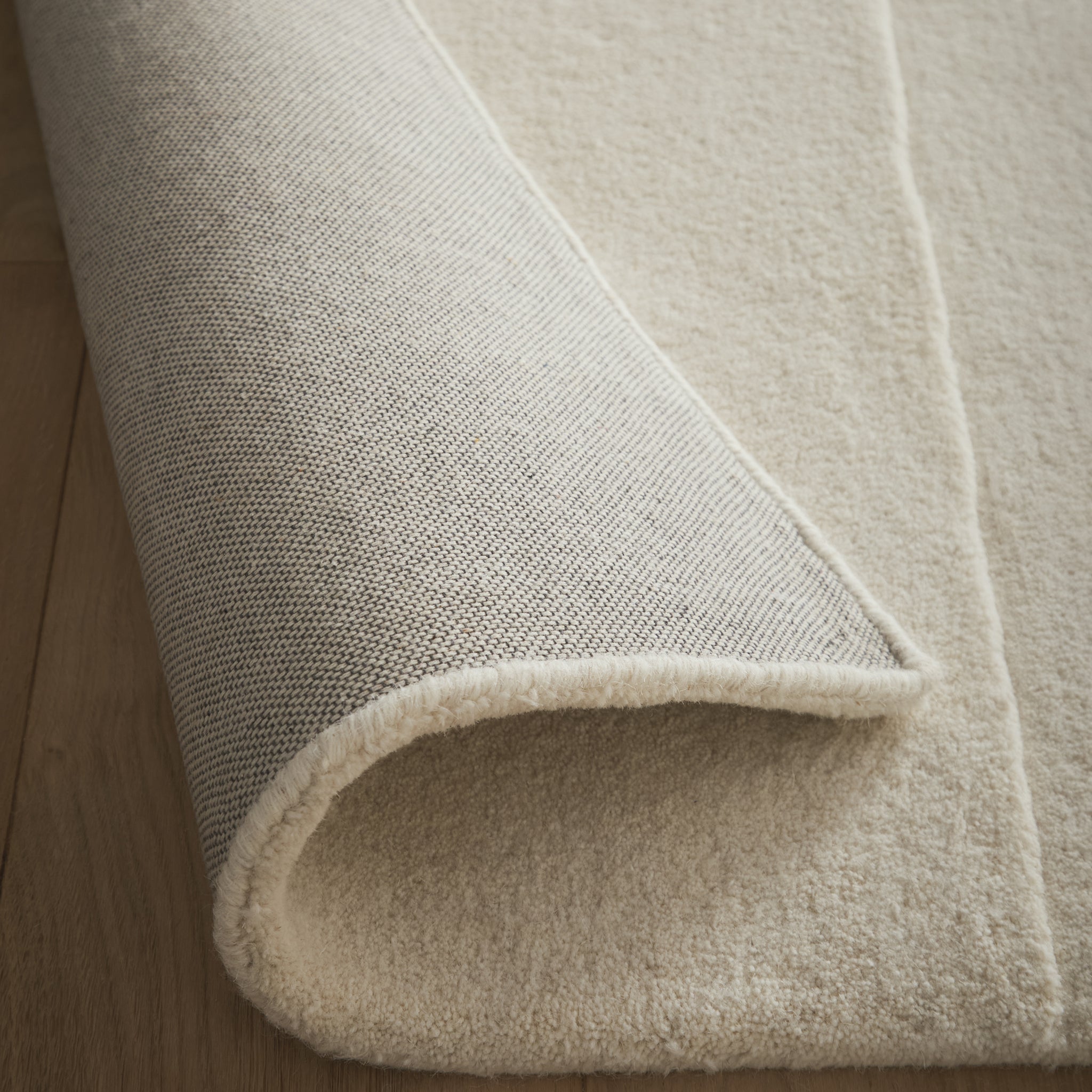 Sculptured Rug- 100% wool cut pile rug in Cream with a sculptured pattern.