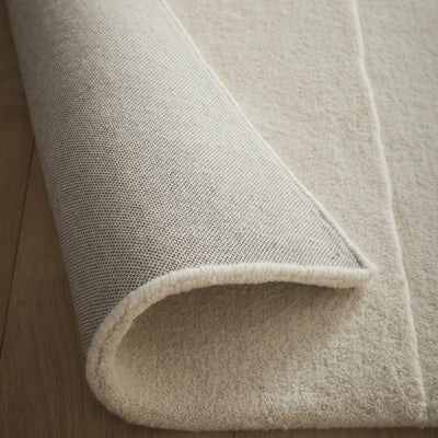 Sculptured Rug- 100% wool cut pile rug in Cream with a sculptured pattern.