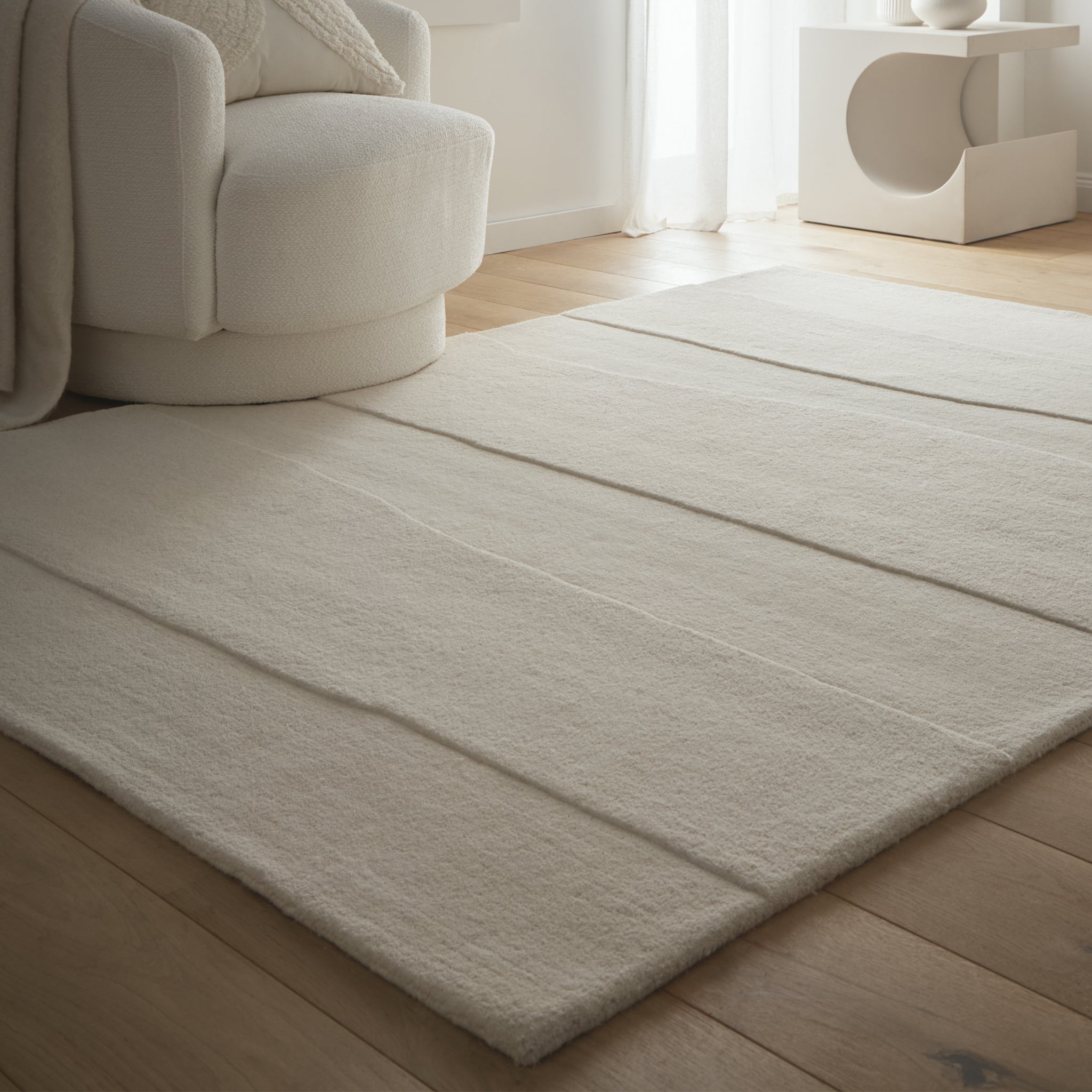 Sculptured Rug- 100% wool cut pile rug in Cream with a sculptured pattern.
