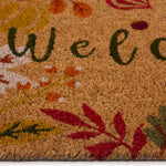 Discover the Autumnal Welcome Coir Doormat- a coir doormat featuring leaves, berries, pumpkins and mushrooms with a graphic font. 