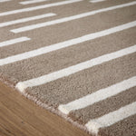 Broken Stripe- hand-tufted wool cut pile rug in Brown and White with a broken striped design.