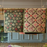 Lifestyle image of two Hug Rug indoor washable doormats hung to dry
