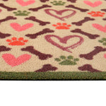 Close up of Hug Rug beige hearts and bones washable doormat pattern and texture