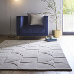 Penny Rug – 100% wool hand-tufted rug in Infinity blue with sculpted 3D geometric pattern.