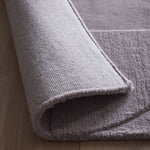 Penny Rug – 100% wool hand-tufted rug in Infinity blue with sculpted 3D geometric pattern.