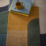 Retro Deco- 100% wool cut & looped pile, hand-tufted rug in multi with a geometric design. 
