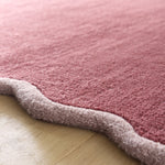Scalloped Elise- 100% wool cut & loop pile rug in Coral and Lilac with a thick border. 
