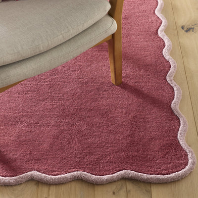 Scalloped Elise- 100% wool cut & loop pile rug in Coral and Lilac with a thick border. 