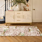 Floral hydrangea rug on a wooden floor in hallway with a cabinet in the background