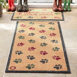 Lifestyle image of muddy wellies on Hug Rug beige wipe your paws washable doormat and washable runner